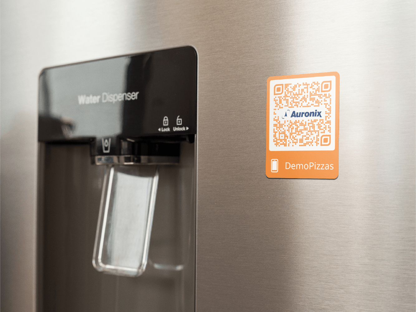 fridge-magnet-mockup-on-a-metallic-fridge-near-the-water-dispenser-a14790